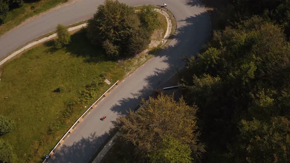 Aerial view of people racing at a longboard event alt
