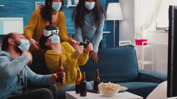Multiethnic Friends Having Fun Playing Video Game with Vr Headset alt