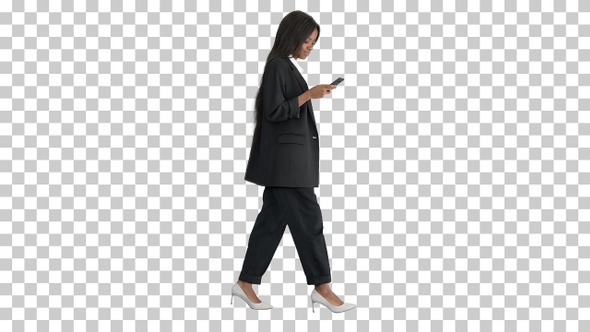 Smiling african american female texting, Alpha Channel alt