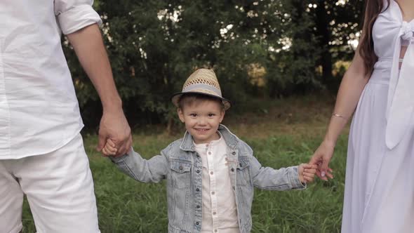 Happy Family with One Child Before a Picnic in the Park