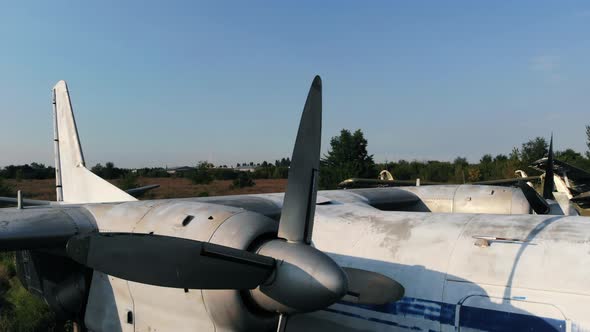 Antonov24 Airplane with Propellers on Airfield at Sunset