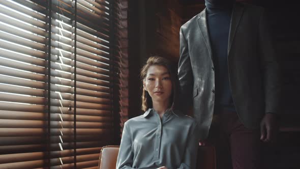 Portrait of Stylish Multiethnic Couple at Home alt