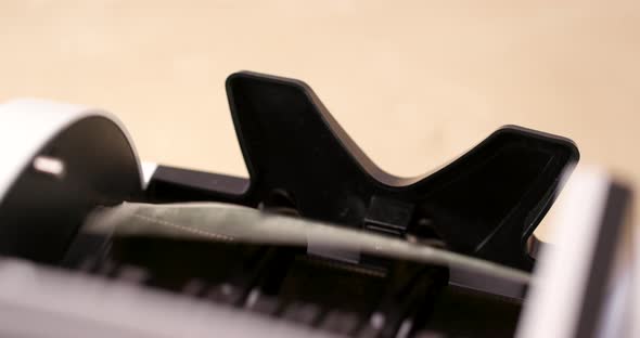 US dollar with money counting machine alt