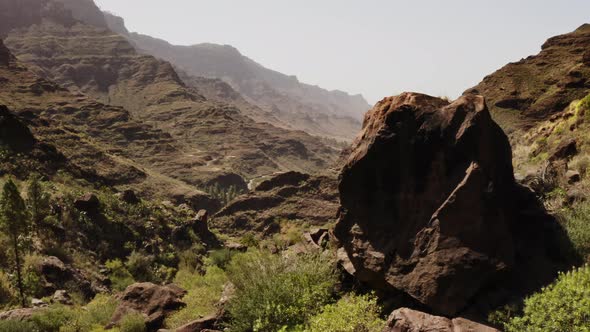 Aerial Shot of the Gran Canaria Valley with Huge Boulder and Pine Trees