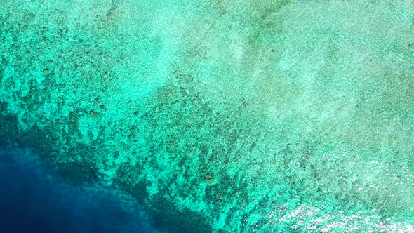 Tropical aerial abstract shot of a white sandy paradise beach and aqua blue water background in colourful alt