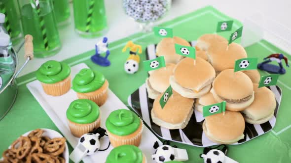 Kids football party set with snacks and drinks. alt