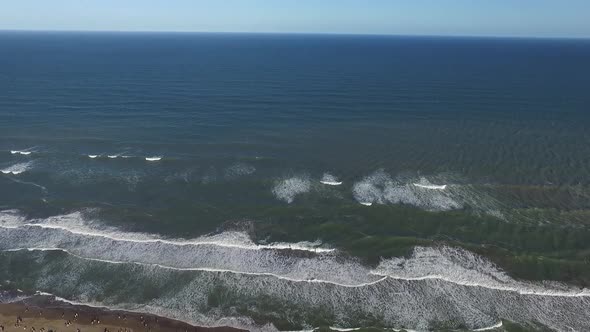 Aerial scene with drone from the beach. The camera moves forward along the beach. Buenos Aires, Arge alt