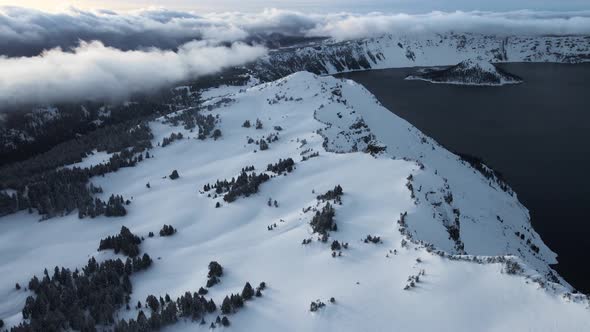 Aerial view of Crater Lake with Wizard Island with ice in winter, Oregon, USA alt