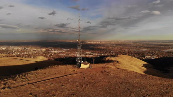 A late afternoon pan over a communication tower alt