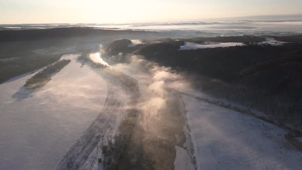 Cinematic Landscape Aerial Horizon View at Sunny Winter Day Early Morning Sunrise Over the River