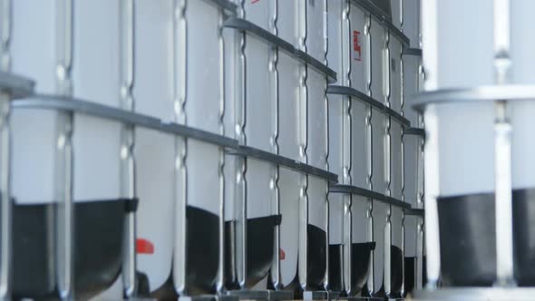 Camera Moves Slowly Along Intermediate Bulk Containers