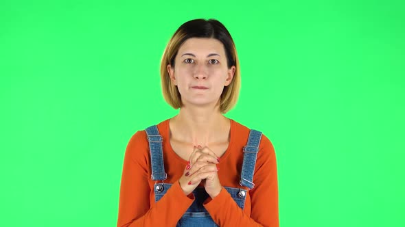 Female Stands Worrying in Expectation Then Smiles with Relief, Carried. Green Screen alt