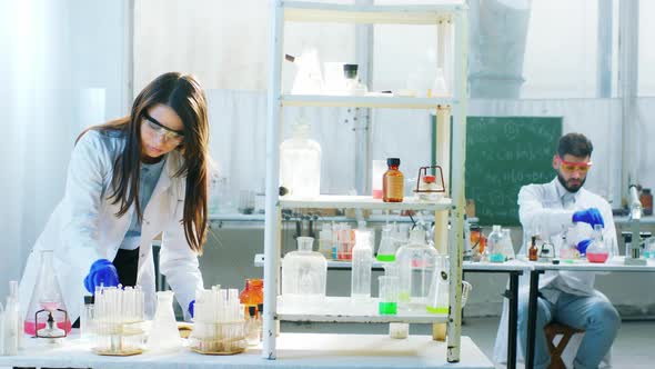 In the Chemistry Laboratory Two Scientist Man and