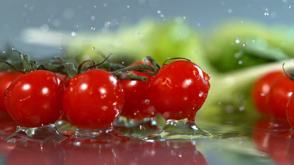 Tomatoes Falling to Water in Super Slow Motion Shot with High Speed Cinema Camera in   1000Fps alt