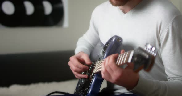 Musician Playing His Music Fingerpicking with His Fingers on the Guitar
