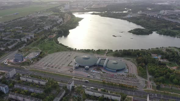 Top View of the Street and the Sports Complex in Chizhovka and the Reservoir alt