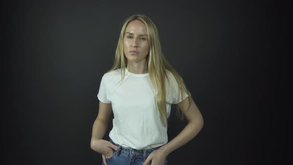 Blonde Actress Plays Role of Disappointed and Angry Woman alt