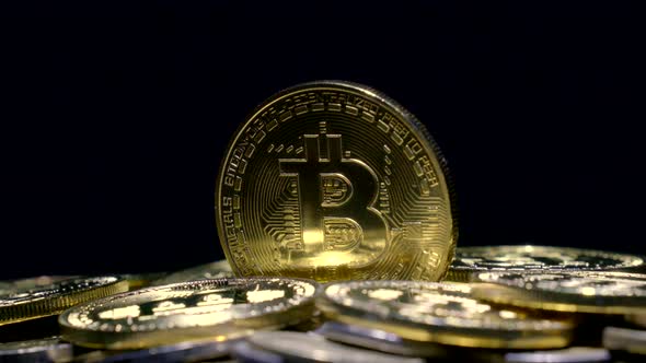golden bitcoin cryptocurrency in dark background