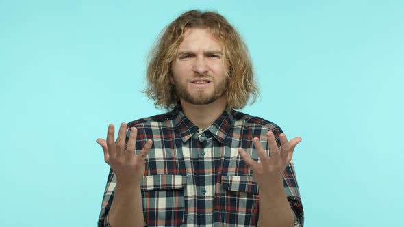 Slow Motion of Blond Bearded Guy with Wavy Long Hair Cant Understand Something Shrugging Shoulders