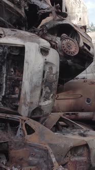 Vertical Video of a Dump of Destroyed Cars During the War in Ukraine alt