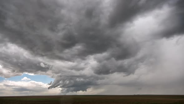 Time lapse of severe storm rotating in the sky trying to form a tornado alt