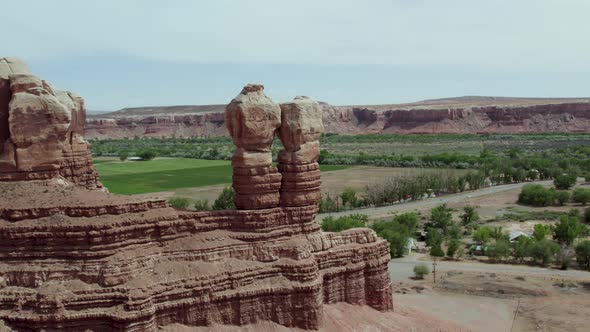 Navajo Twins Rock Formation in Southwest Desert Town of Bluff, Utah, Aerial alt