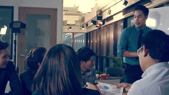 Asian Business People Discuss Marketing Strategy alt