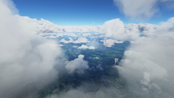 Flying through clouds over mountains