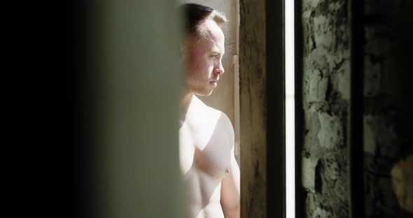 Bodybuilder At The Window Playing Chest Muscles alt