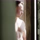 Bodybuilder At The Window Playing Chest Muscles - VideoHive Item for Sale
