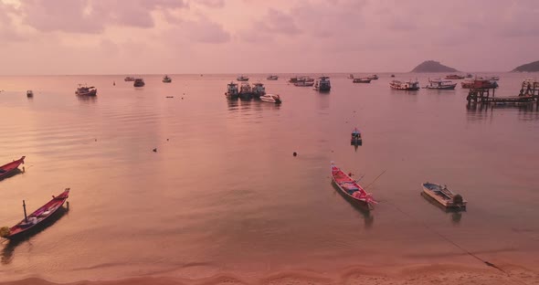 Thailand's Ocean Aerial Pink Sunset Sky Reflection on Waterfront with Boats and Ships