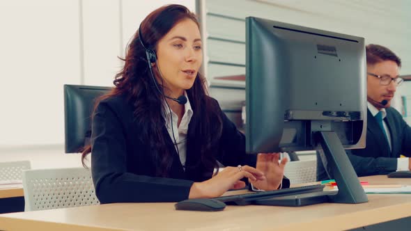 Business People Wearing Headset Working in Office alt