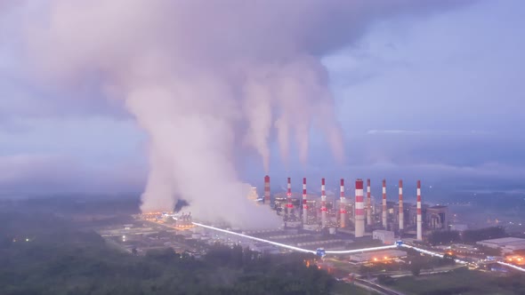 Aerial view of coal-fired power plants that steam into the atmosphere.