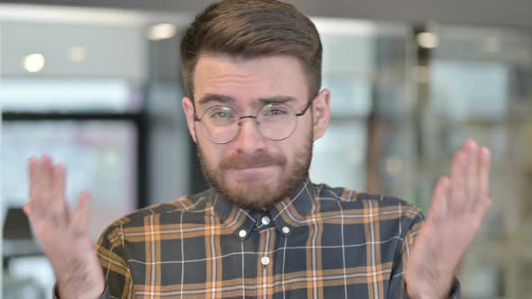 Portrait of Shock Young Designer Reacting To Loss in Office alt
