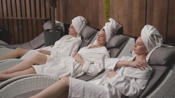 Three Beautiful Women Wearing Bathrobes Having Cool Resting Holidays