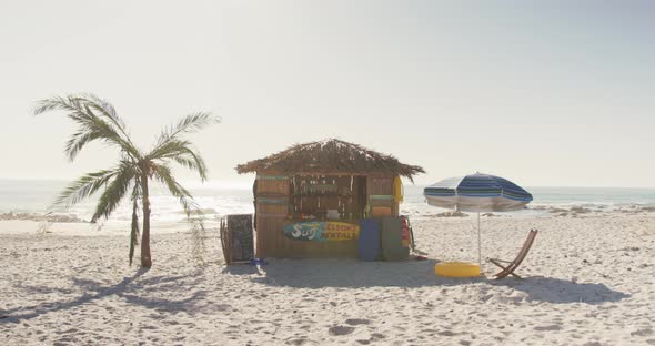 View of a wooden shed on the beach alt
