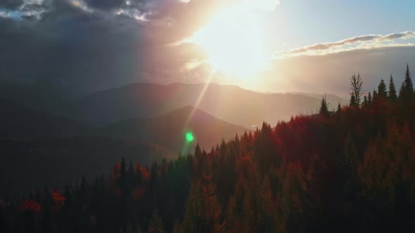 Tilt up cinematic Stunning Beauty Dark movement of Mystical Autumn Sunset in Mountains