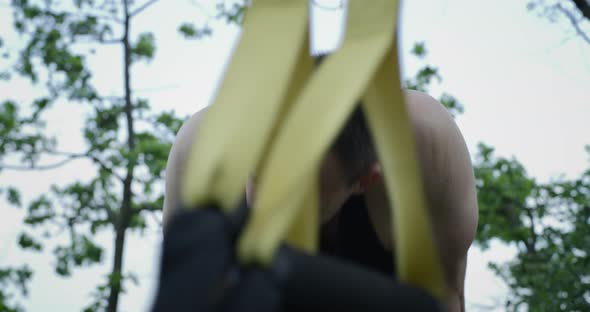 Athletic Man Using Sport Slings alt