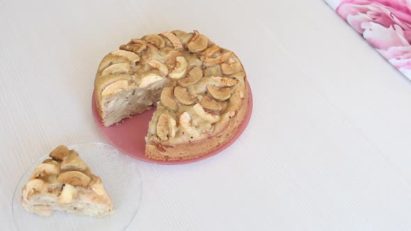 Baked And Sliced Apple Pie. Cooking Charlotte At Home. Shooting The Camera On The Slider. alt