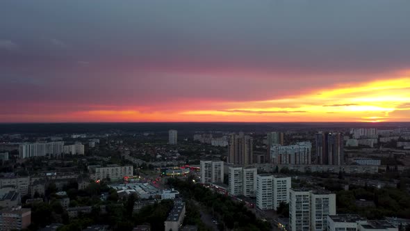 Epic aerial sunset in city residential district