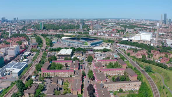 Dolly forward rising drone shot of Millwall FC stadium Bermondsy South London alt