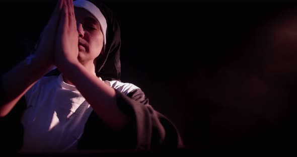 Nun Praying In Church