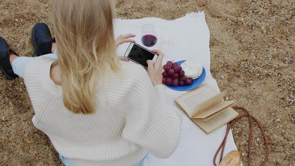 Woman Digital Creator Takes Picture of Picnic
