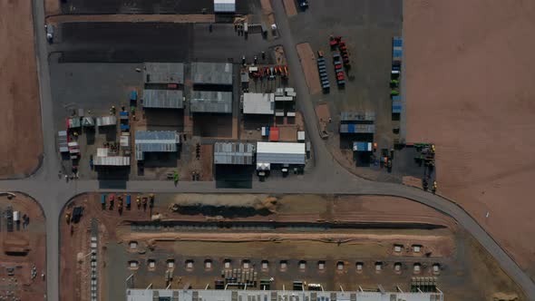Equipment at Construction Building Site for a Factory in Germany, Aerial Top View alt