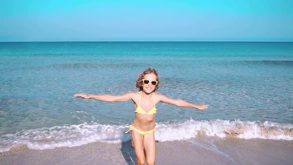 Happy Child Playing in the Sea. Kid Having Fun at the Beach