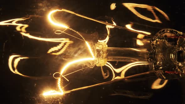 The Tungsten Filament in Classic Incandescent Glass Lamp Heats Up and Cools Down alt