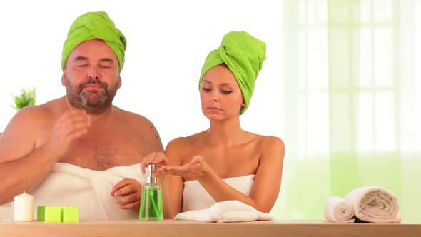 Overweight Man and Slim Woman Beauty Treatment at Health Spa