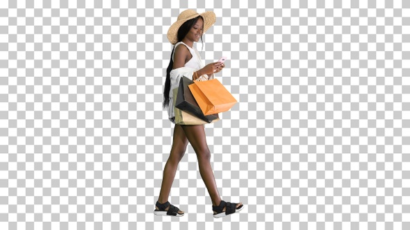 Happy african american woman in hat walking, Alpha Channel alt