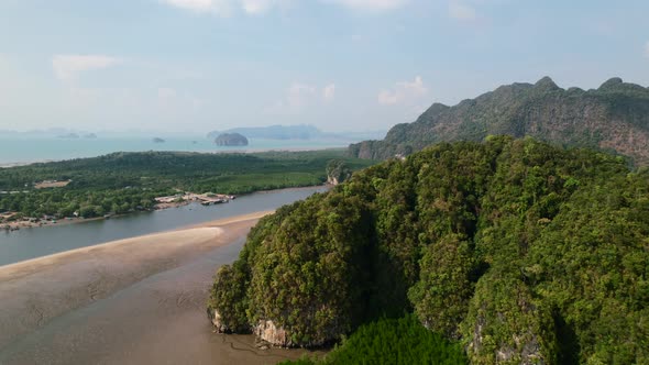 Drone revealing a large sandbar, mangroves and mountains in Ao Thalane ...