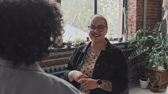 Short-haired Woman Chatting with Friends alt